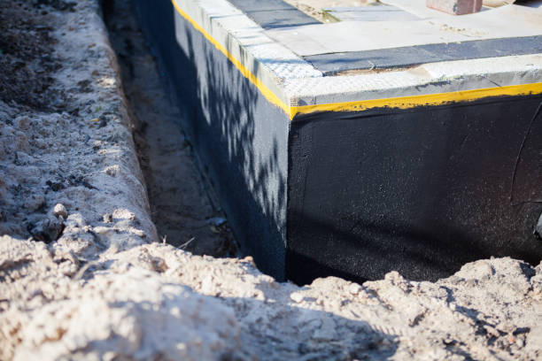 Professional Waterproofing technician working in Crystal, MI